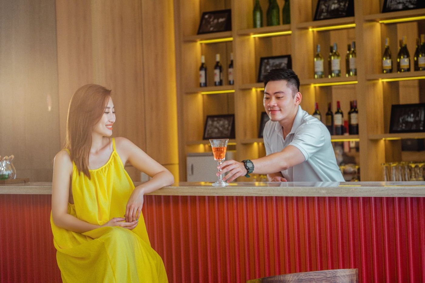 A couple raising a cocktail at the Sea Lounge bar