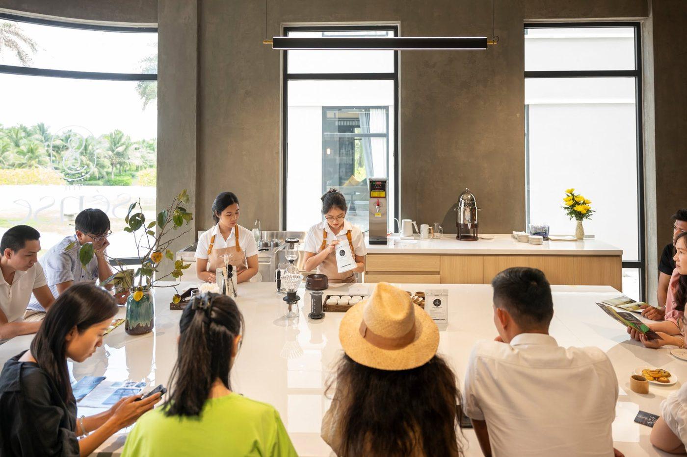 People working around a long bright table