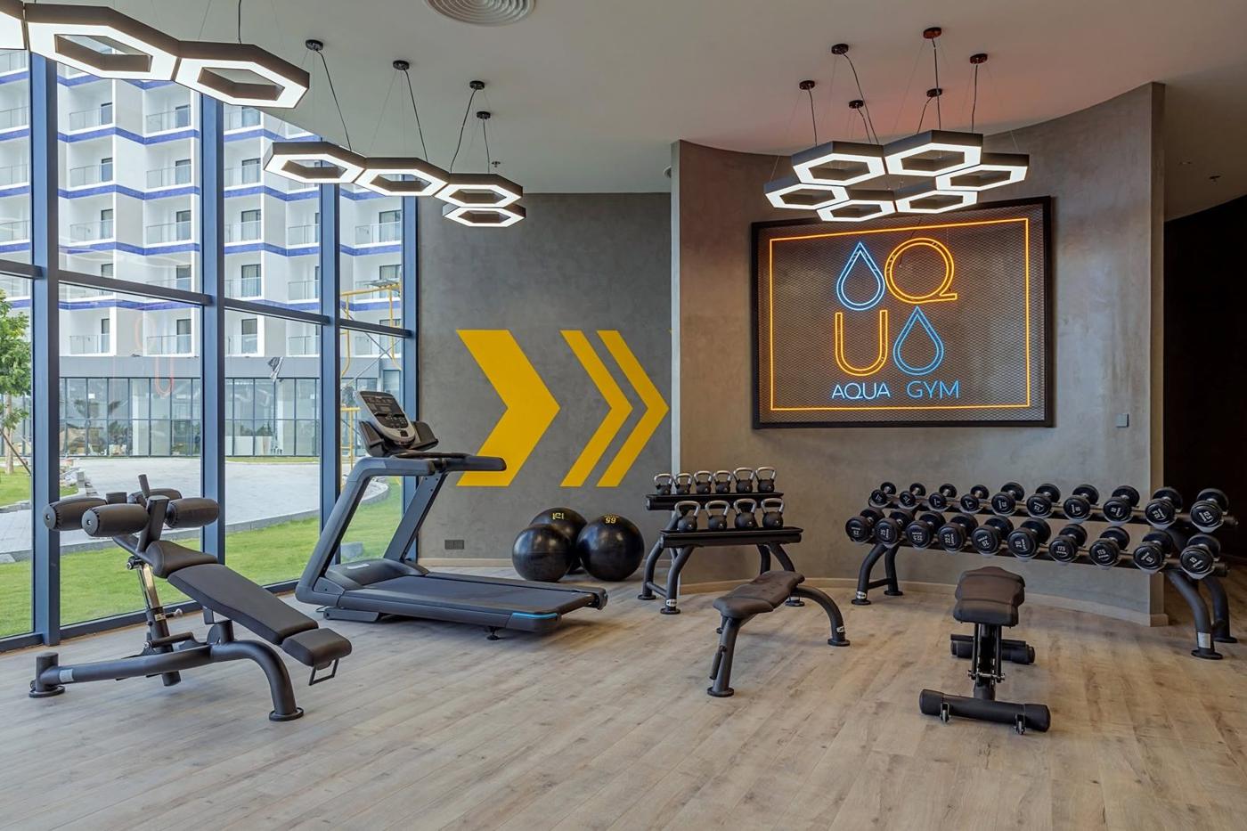 Bright gym with treadmills and weights